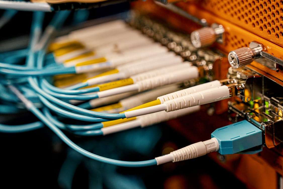 Fiber optic cables connected to network equipment