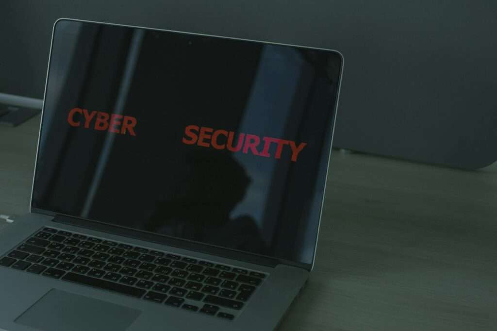 Laptop screen displaying cybersecurity interface representing AI-driven network security for enterprise and government clients