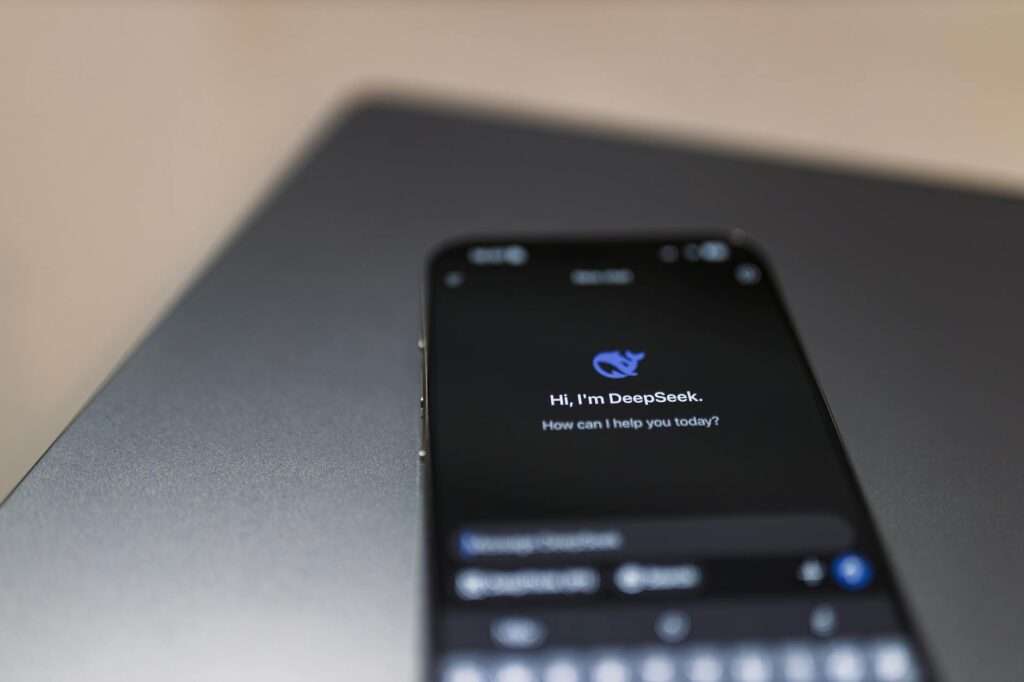 Smartphone with AI virtual assistant technology representing AI-powered phone number systems