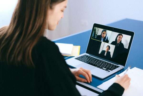 Professional participating in a video conference call for remote team collaboration