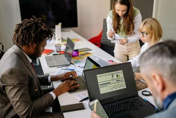 Employees collaborating using digital workplace technology to improve employee experience