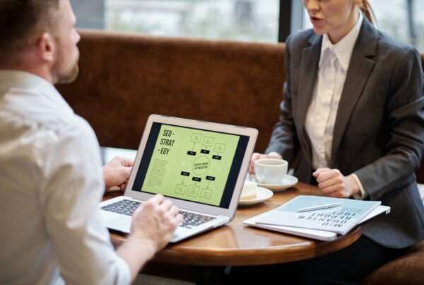 Business professionals discussing IT strategy alignment and technology planning