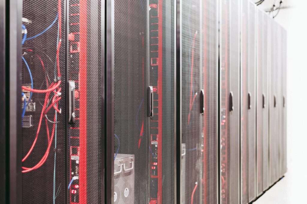 How Managed IT Services Help Businesses Reduce Downtime and IT Headaches 3 Server room and network infrastructure managed by IT professionals to reduce downtime