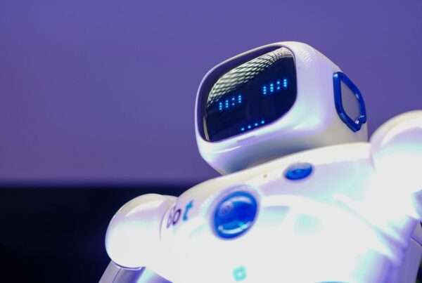 Humanoid robot with digital face representing AI technology and automation for businesses