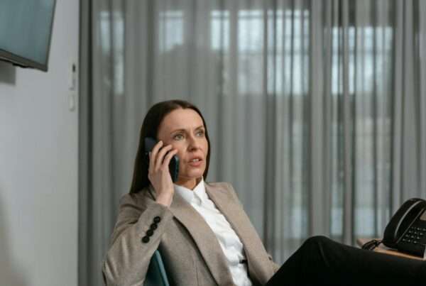 Professional using a business phone, representing a review of business phone systems