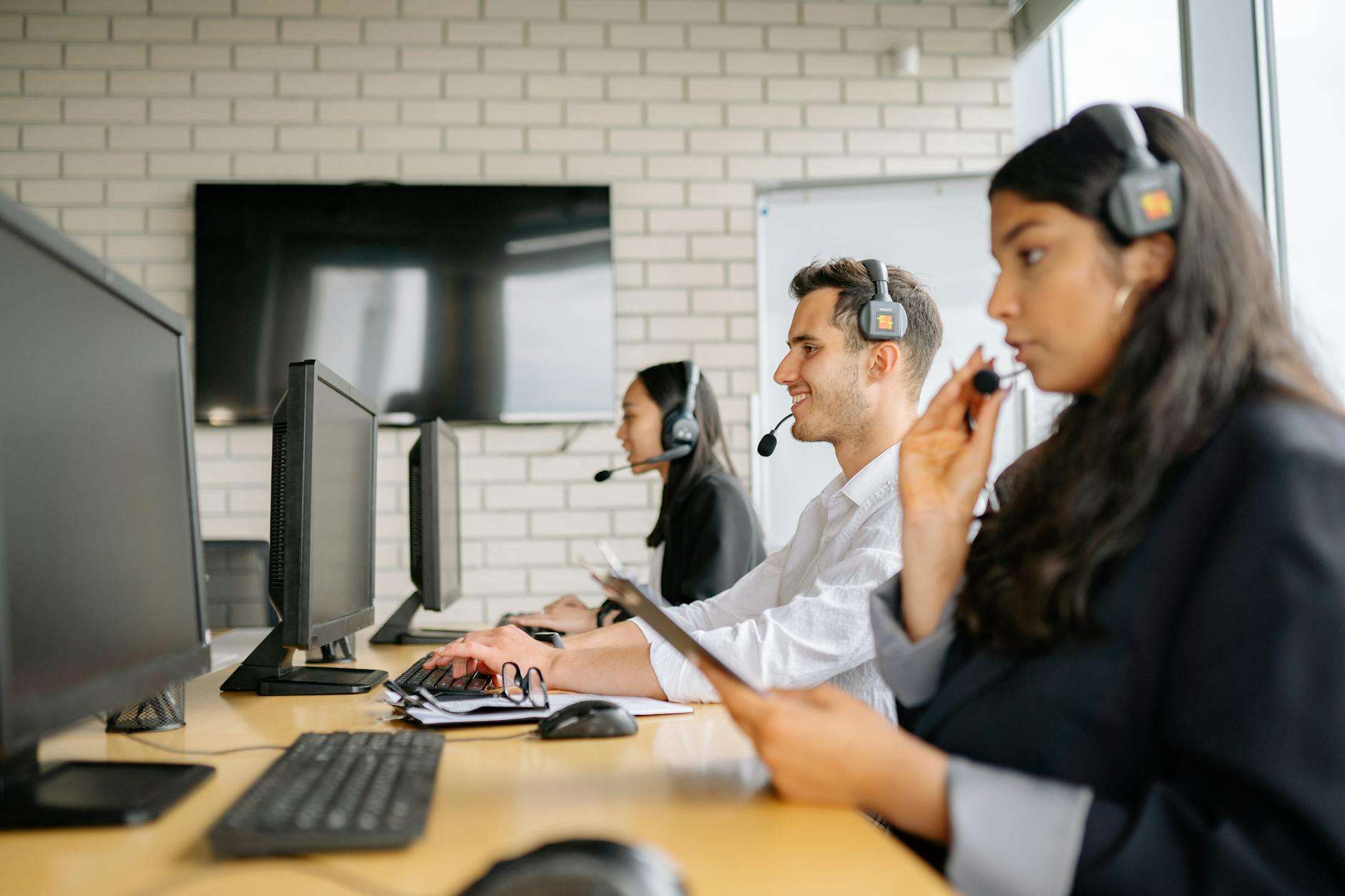 Contact center representatives at workstations, representing contact center platform options