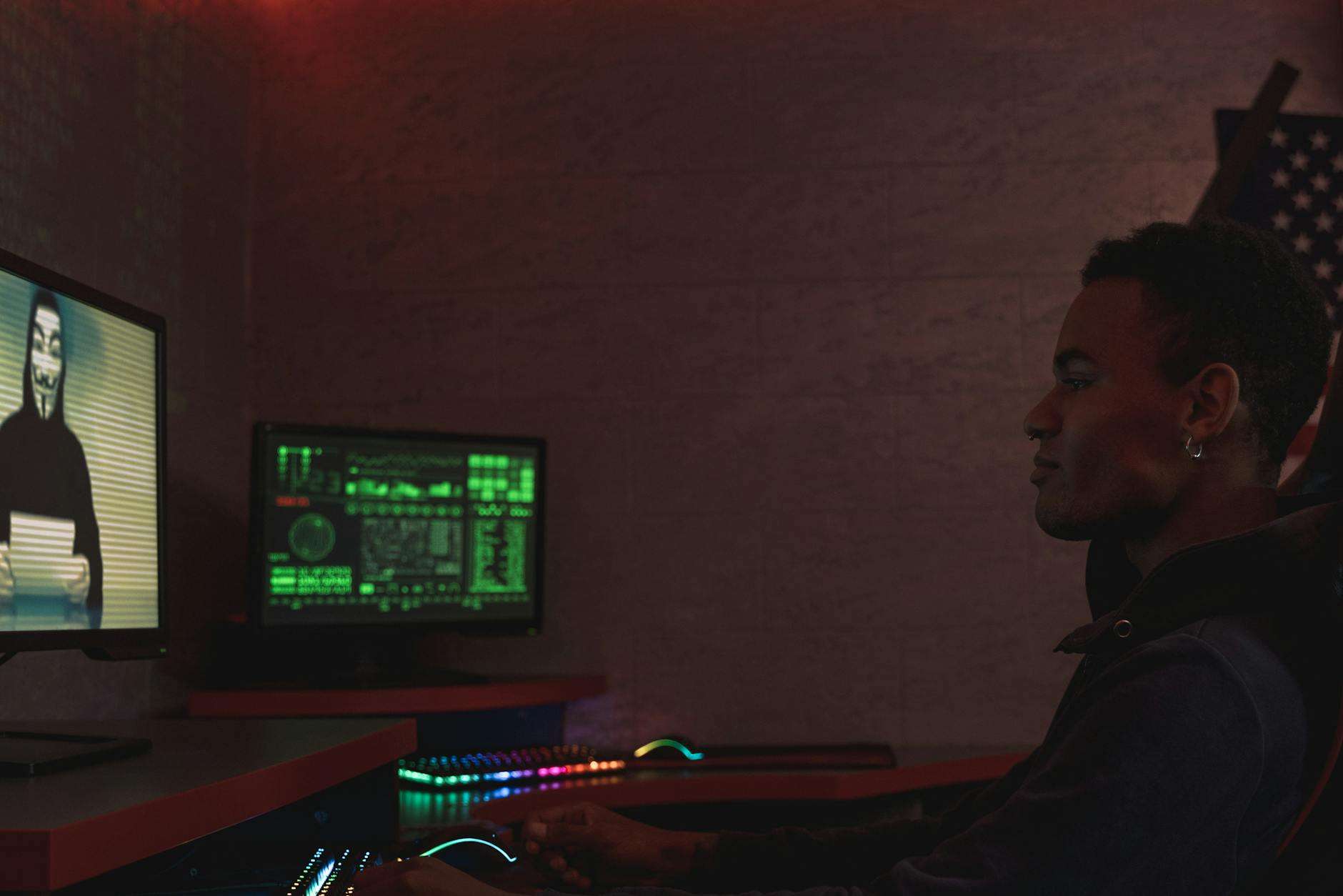 Cybersecurity professional monitoring screens for online threats and malicious activity, representing protection against SEO poisoning attacks