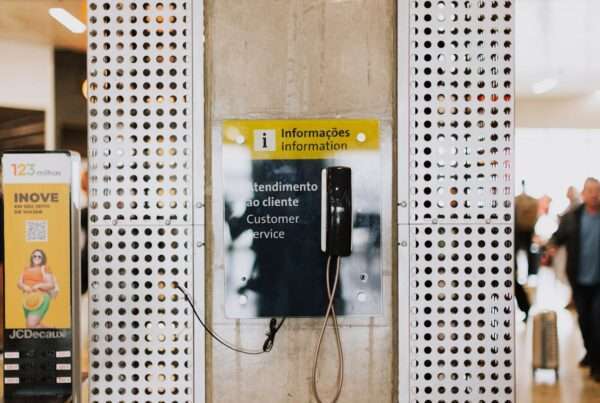 A professional customer service representative handling calls at a phone station