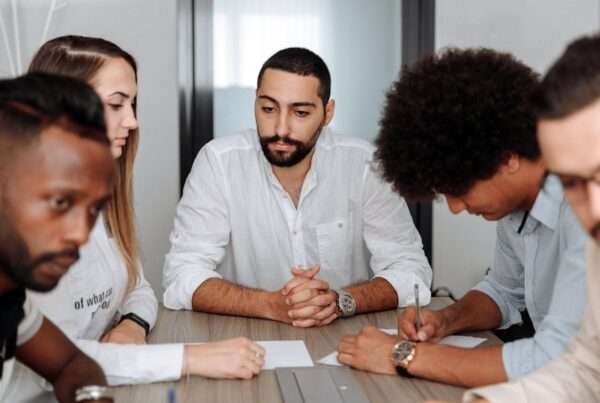 A diverse team of business professionals collaborating in an office meeting