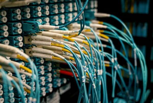 Fiber optic cables and connectors representing high-speed network infrastructure for AI-ready business networks