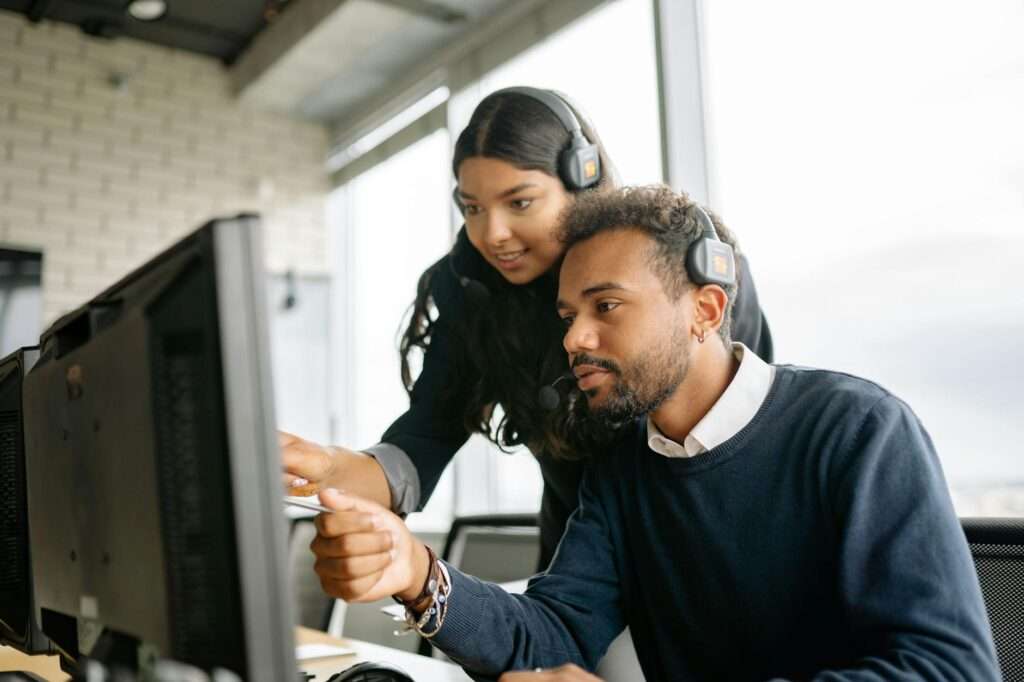 Customer support team working at computers, representing generative AI in customer service
