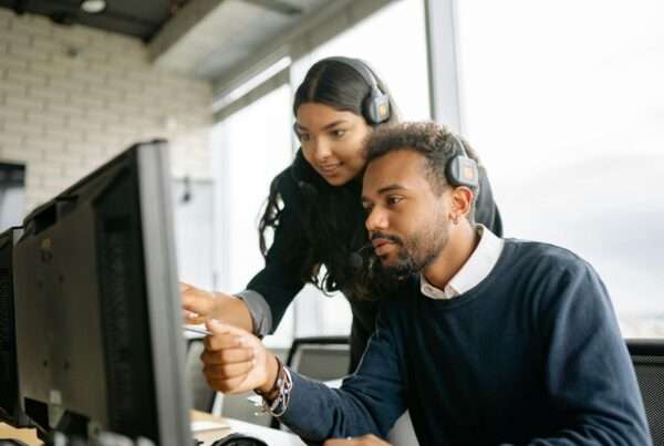 Customer support team working at computers, representing generative AI in customer service