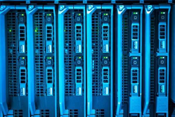 Illuminated server racks in a modern data center, representing AI-driven network security monitoring for regional telecom and enterprise clients