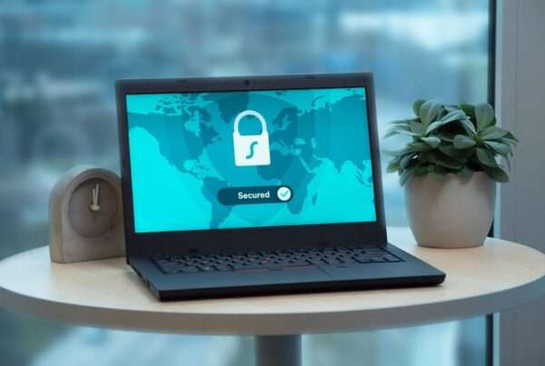 Laptop displaying a security lock icon, representing security controls required by cyber insurers