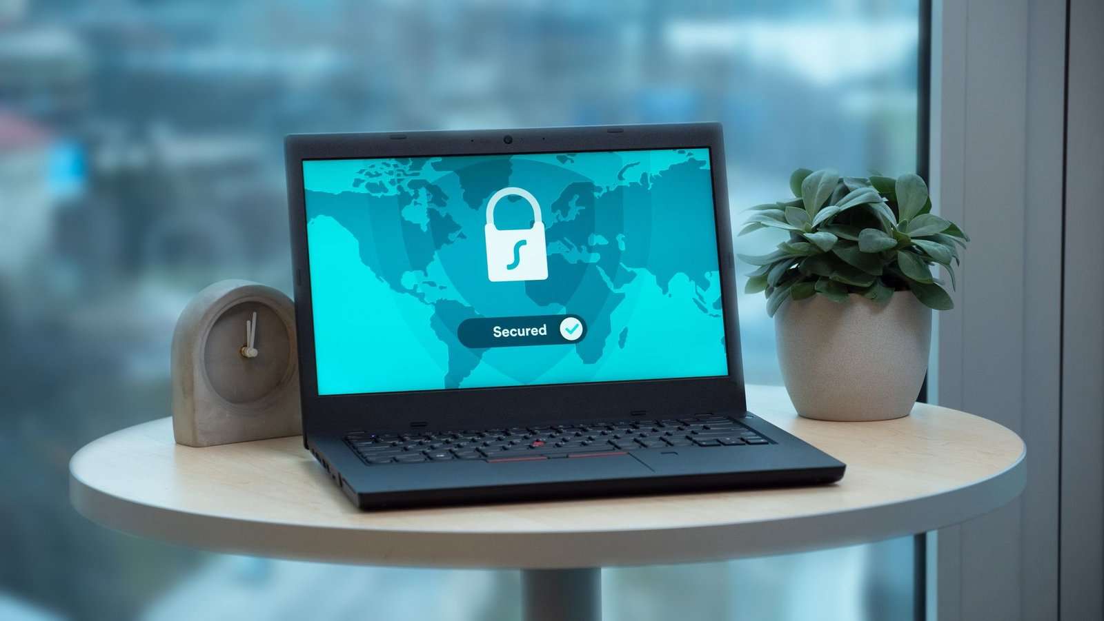 How to Meet Cyber Insurance Requirements and Lower Your Premiums 6 Laptop displaying a security lock icon, representing security controls required by cyber insurers