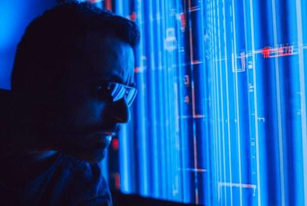 A professional studying a holographic digital screen representing AI-powered network security