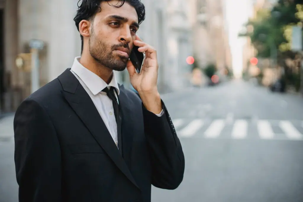 10 Best Business Phone Apps in 2026 (Reviewed & Compared) 2 A professional businessman making a business phone call representing mobile business communication