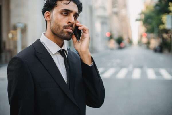 10 Best Business Phone Apps in 2026 (Reviewed & Compared) 5 A professional businessman making a business phone call representing mobile business communication
