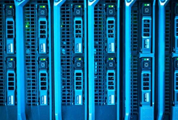 The Edge Comes Home: Cytranet CTO Doug Roberts on Why AI Is Bringing Computing Closer to the Customer 2 Rows of illuminated server racks in a modern data center representing edge computing infrastructure