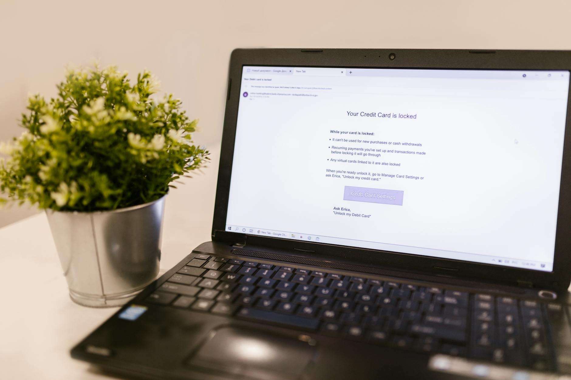 Laptop showing a security alert about an account threat