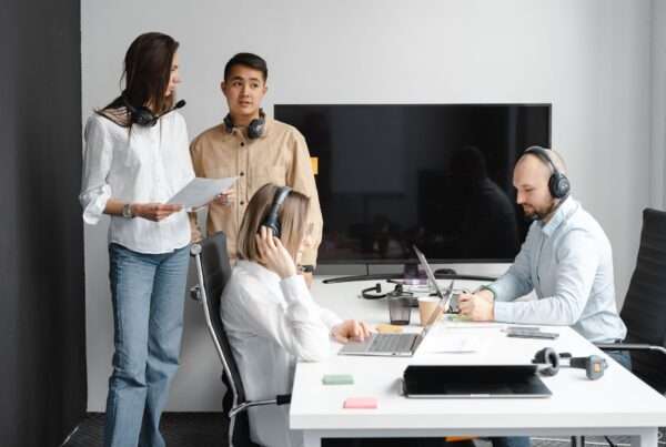 Team collaborating with a unified communications platform in a modern office