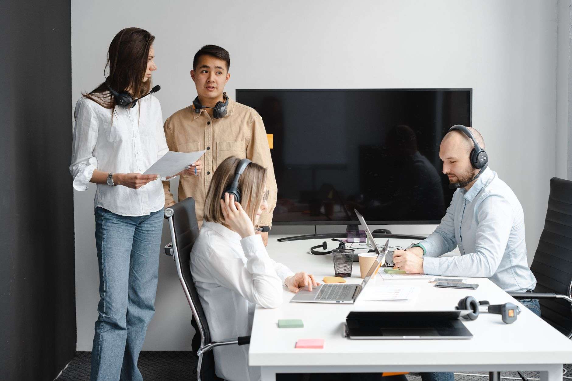 Best UCaaS Alternatives for Business Communications in 2026 5 Team collaborating with a unified communications platform in a modern office