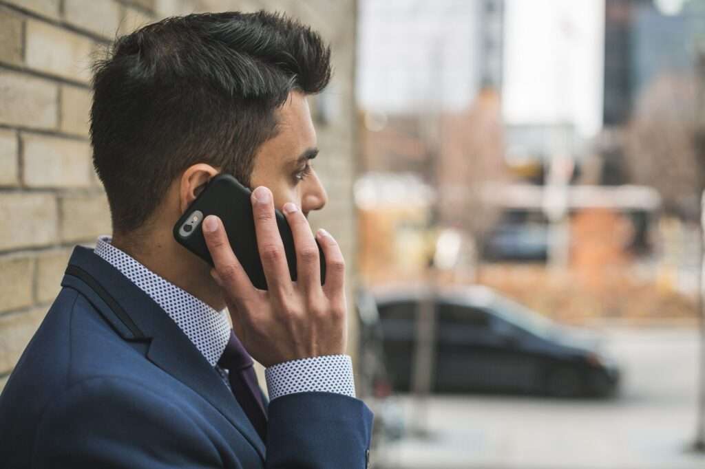 Business professional receiving a branded caller ID call on smartphone