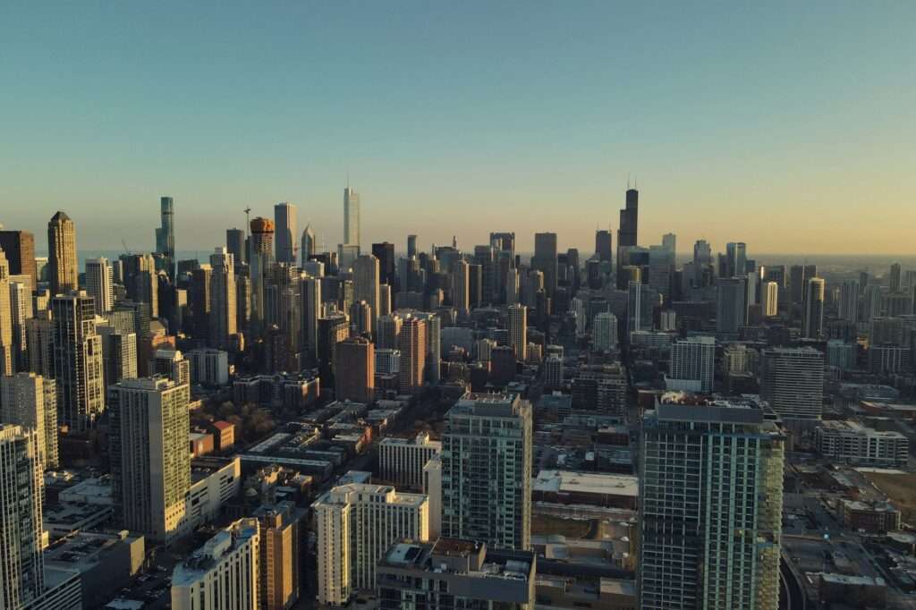 Aerial view of a major U.S. city skyline at sunset representing the best American cities for starting and scaling a business in 2026