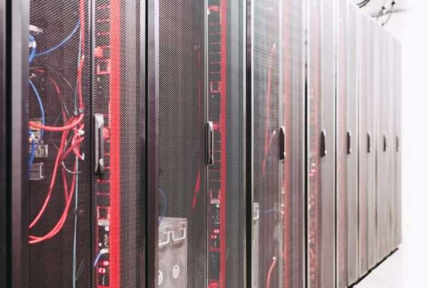 Server racks in a data center representing AI-driven network security monitoring for regional telecom infrastructure