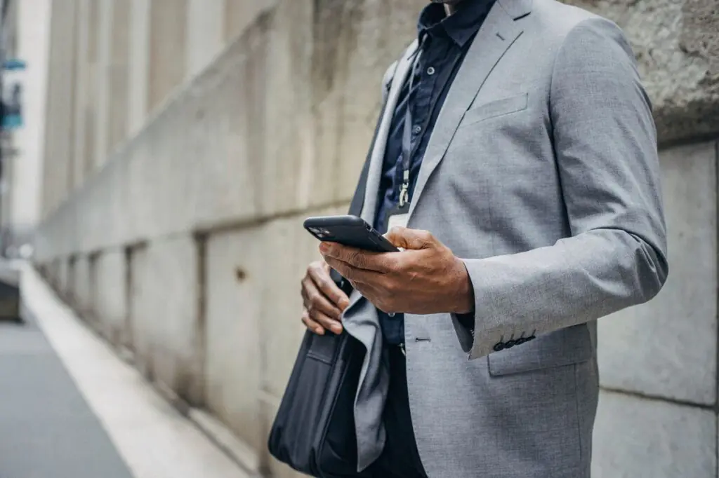 Business Texting or Email? A Practical Channel Guide for Customer Communications 3 Business professional using a mobile phone