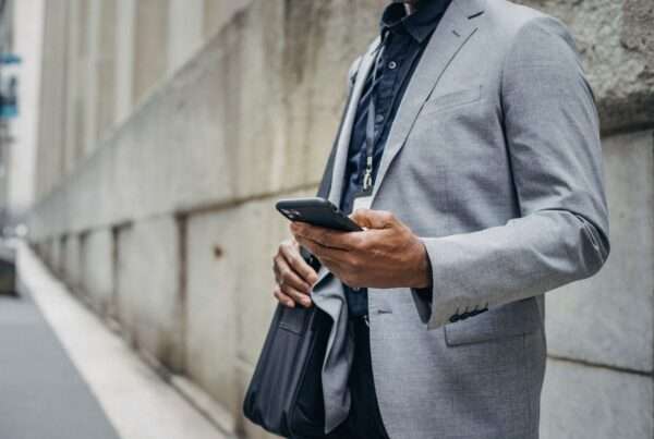 Business Texting or Email? A Practical Channel Guide for Customer Communications 6 Business professional using a mobile phone