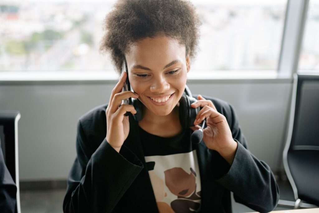 VoIP Security in 2026: How Cytranet Protects Your Business Phone System 3 Smiling business professional wearing a headset while taking a call on a business VoIP phone system