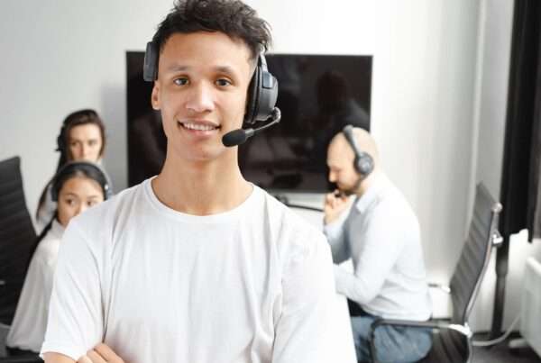 What Is a Hosted PBX? A Practical Guide to Cloud Business Phone Systems 5 Office professional using a headset connected to a cloud-hosted business phone system