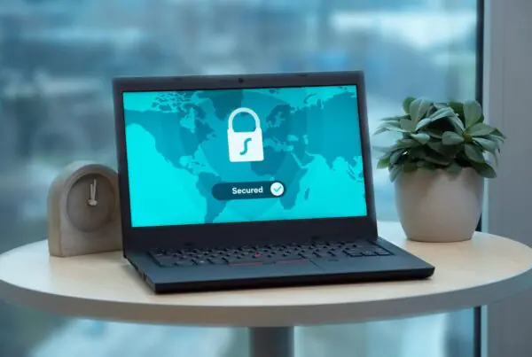 Fake Interpol “Investigation” Emails Are the Latest Way Ransomware Reaches Small Businesses 5 Laptop screen showing a security lock icon, representing network security and ransomware protection