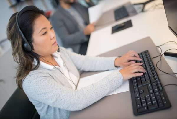 Smarter Business Call Routing: How to Design a Faster Path to the Right Person 7 Customer support professional managing business calls