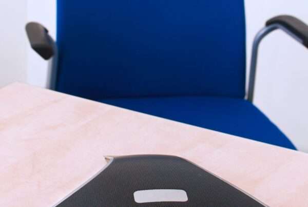 Modern conference phone on office desk representing business communications technology