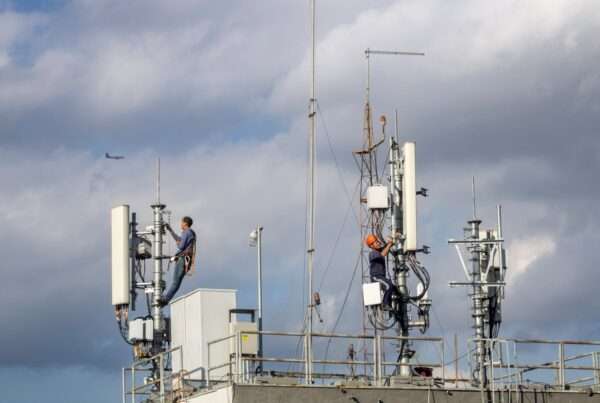 Cytranet Is Creating Jobs and Building Infrastructure Across a Challenging 2026 Economy 4 Two telecom technicians working on a communications tower, representing the skilled jobs behind Cytranet's fiber and wireless network infrastructure across Nevada, Arizona, and California