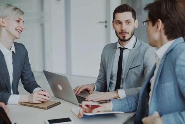 Business professionals collaborating on technology strategy in a modern Orlando office