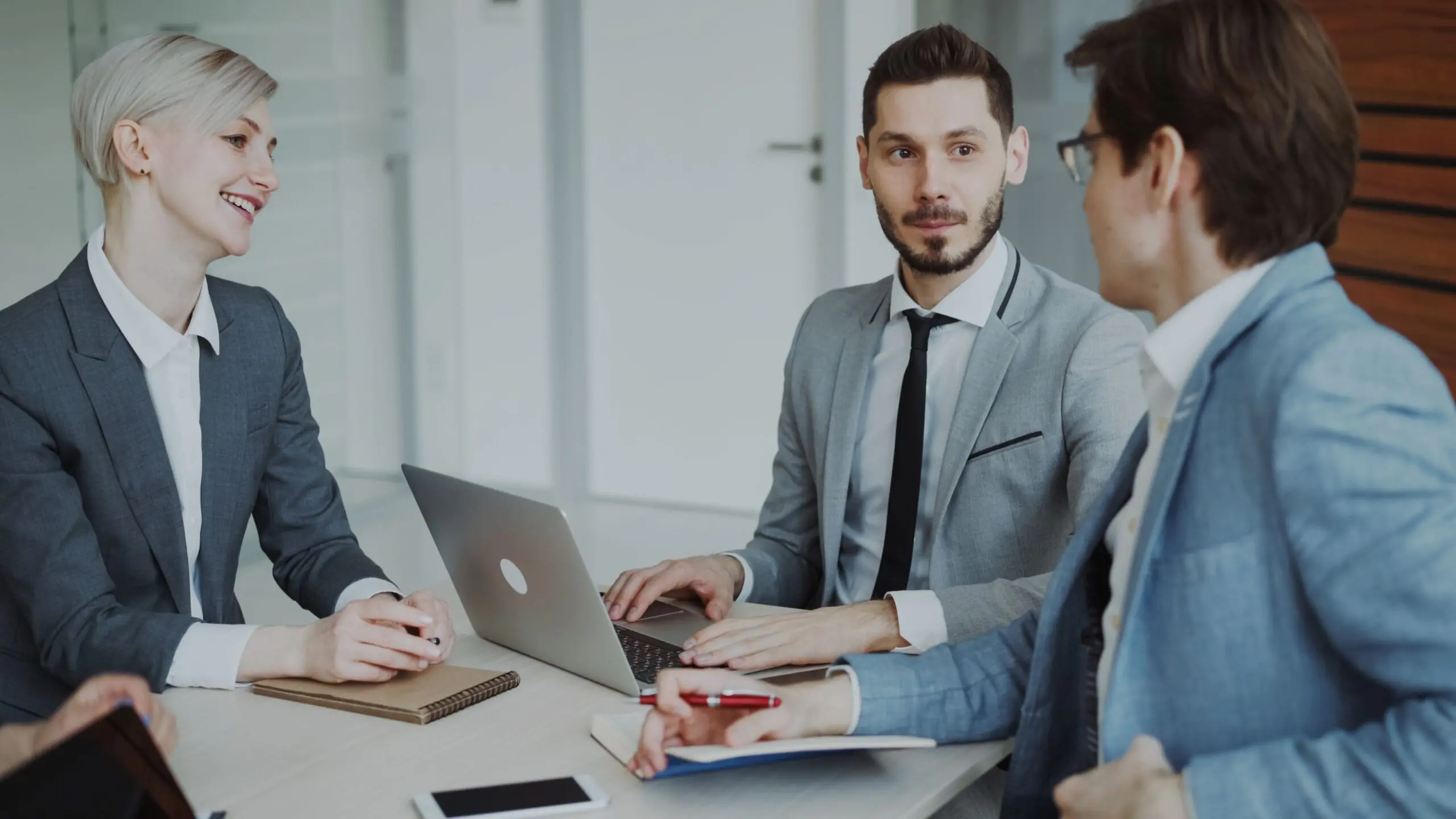 Business professionals collaborating on technology strategy in a modern Orlando office