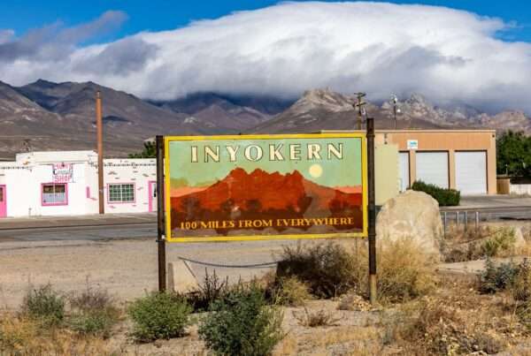 A small rural Nevada town with farm fields, low buildings and desert mountains in the distance where businesses rely on dependable internet connectivity