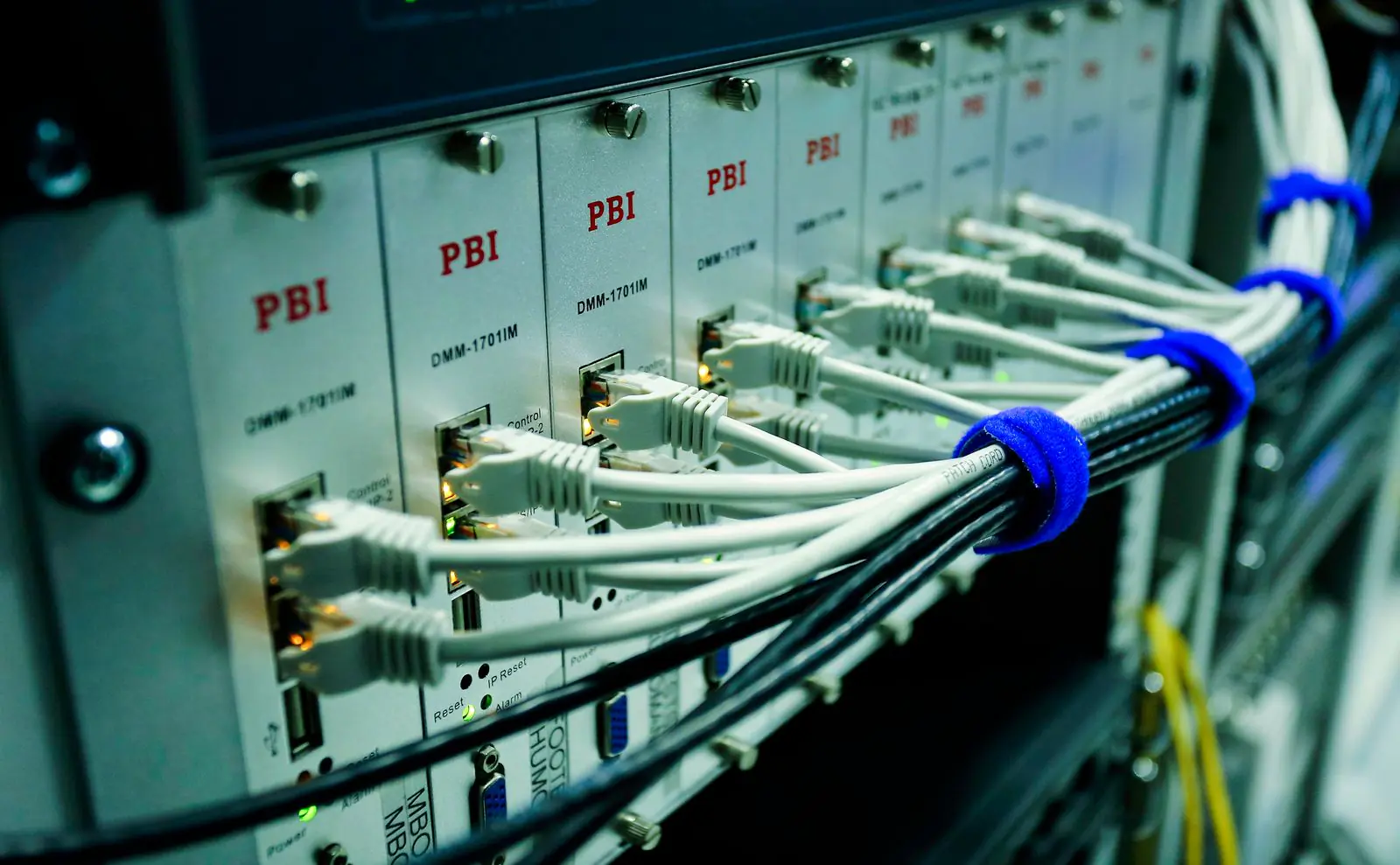 Ethernet cables connected to a network switch panel supporting business internet and VoIP failover