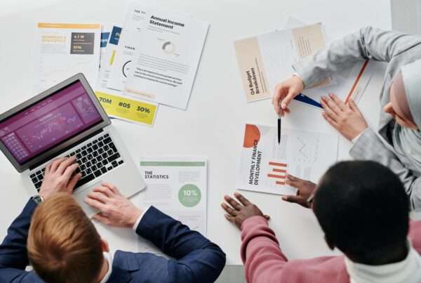 Sales team reviewing a pipeline dashboard on a laptop