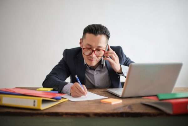 Business professional on a phone call, representing VoIP customer experience research