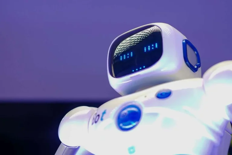 Humanoid robot with digital face representing AI technology and automation for businesses