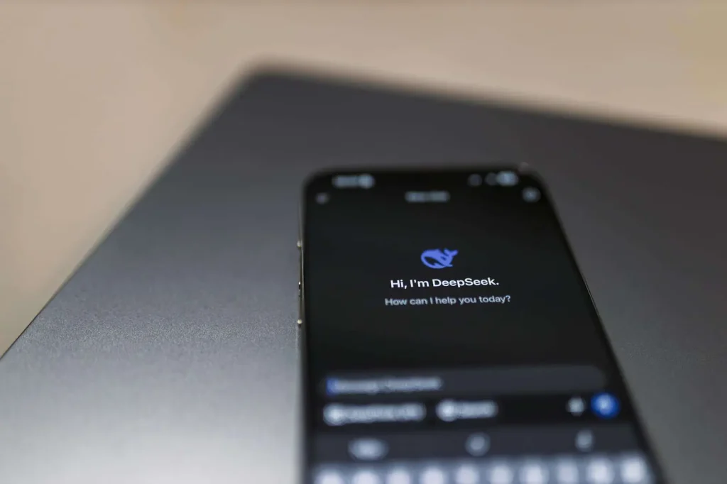 Smartphone with AI virtual assistant technology representing AI-powered phone number systems