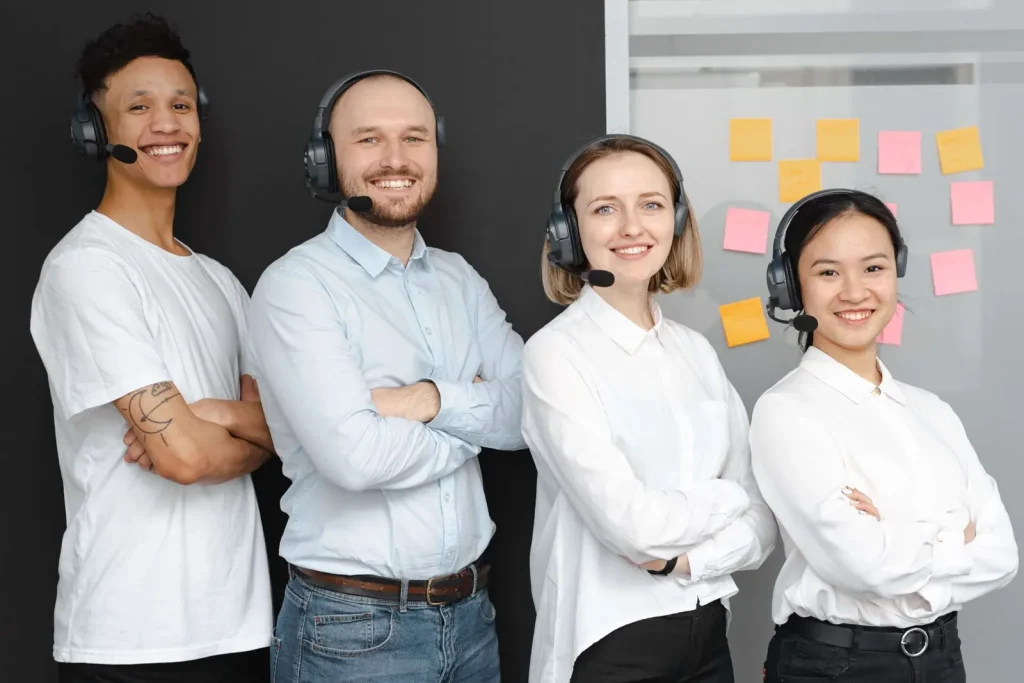 Team of business professionals wearing headsets, representing modern unified communications and business phone systems