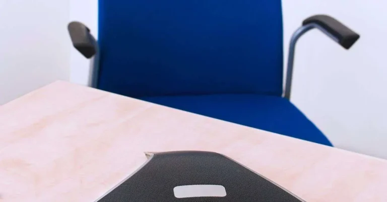 Modern conference phone on office desk representing business communications technology