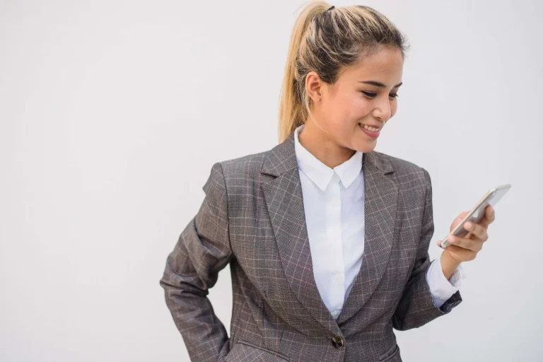 Business professional reviewing a text messaging conversation on a smartphone