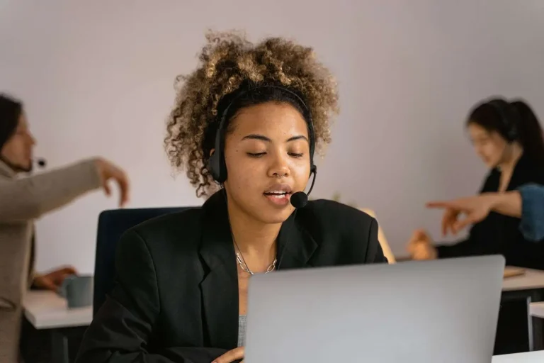 Customer service representative wearing a headset on a business call