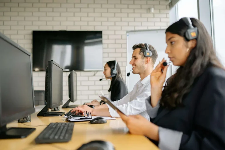 Contact center representatives at workstations, representing contact center platform options